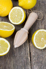 Fototapeta na wymiar lemon juicer on an old wooden table