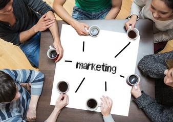 Marketing on page with people sitting around table drinking coff