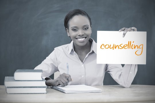 Happy Teacher Holding Page Showing Counselling