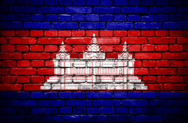 Brick wall with painted flag of Cambodia