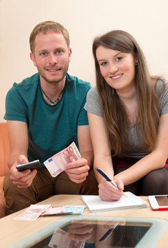 young man and woman counting her money