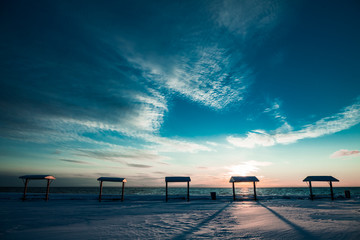 Fototapeta na wymiar Picnic Table at the Sea During the Winter
