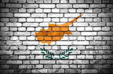 Brick wall with painted flag of Cyprus