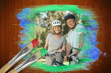 Obraz na płótnie Canvas Composite image of senior couple on bikes in the park
