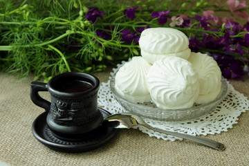 Cup of coffee and white marshmallows.