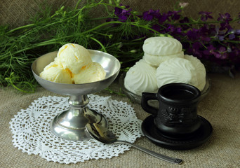 Cup of coffee, ice cream and white marshmallows.