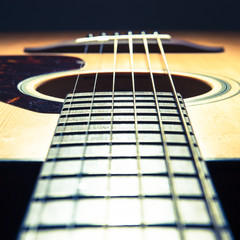 Obraz premium acoustic guitar detail on black background