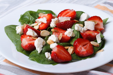 vitamin salad of strawberries, spinach, goat cheese and almond