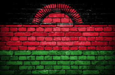 Brick wall with painted flag of Malawi