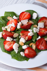 strawberries, spinach, goat cheese and almond top view