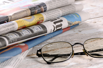 Glasses with the newspaper
