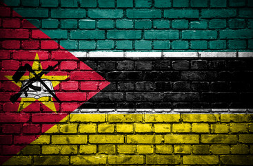 Brick wall with painted flag of Mozambique