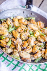 Fried mussels on the pan