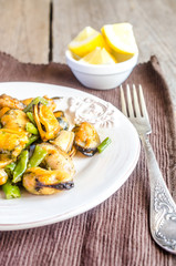 Fried mussels on the plate
