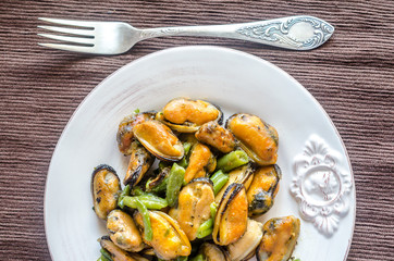 Fried mussels on the plate