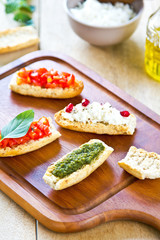 Crostini with Pesto, Cheese,and Tomato