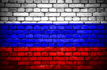 Brick wall with painted flag of Russia