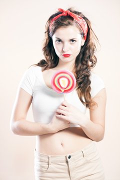 Pin up girl with big lollipop