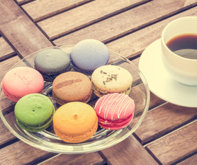 colorful macarons with black coffee