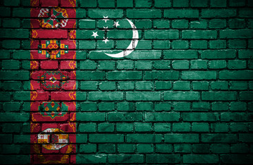 Brick wall with painted flag of Turkmenistan