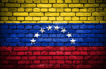 Brick wall with painted flag of Venezuela