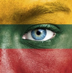 Human face painted with flag of Lithuania