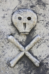 Death head on ancient tombstone in Lozisca, Brac island, Croatia
