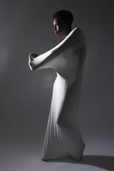 Shapely Woman in Creative Light and Spandex Fabric - obrazy, fototapety, plakaty
