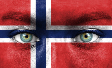 Human face painted with flag of Norway
