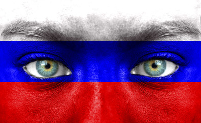 Human face painted with flag of Russia