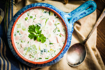Cold summer soup on rustic background