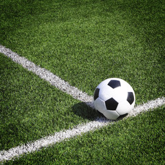 Fototapeta na wymiar view of green striped football field with soccer ball
