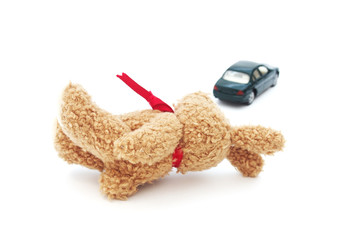 doll and defocused car on white background , accident concept