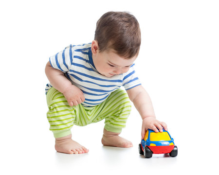 baby boy toddler playing with toy car