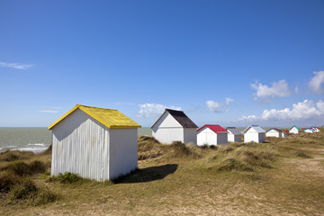 Fototapeta na wymiar Colorful beach cabins at Gouville-Sur-Mer, Normandy