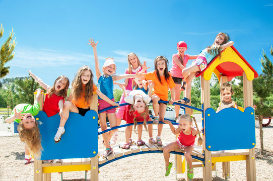 Happy kids playing on playground