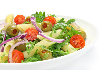 Salad with pasta, arugula, tomato, onion and green olives