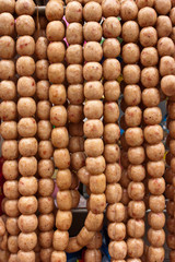 Traditional Thai food, pork sausage at street market, Thailand.