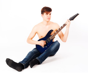 young fit male with electric guitar
