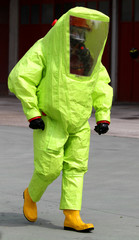 person with anti radiation suit yellow and yellow rubber boots t