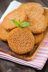 Raw salmon cutlets on a cutting board, vertical shot, close-up