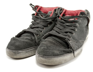 a pair of old sneakers isolated on white