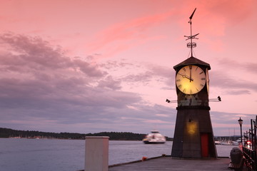 Clock tower on the pier of Oslo - obrazy, fototapety, plakaty