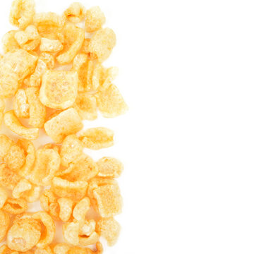 Torreznos, fried pork rinds isolated