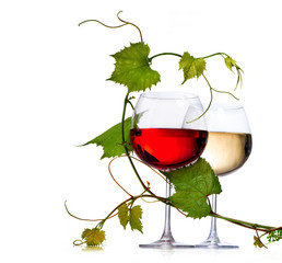 Two glasses of red and white wine decorated with grape leaves
