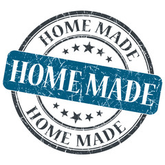 Home made blue round grungy stamp isolated on white background