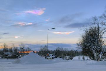 Nacreous clouds over the Stromsund in winter sunset, Sweden