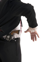 Man holding a gun behind his back