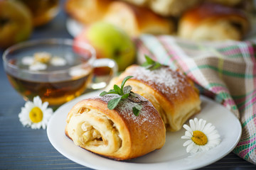 sweet apple muffins with powdered sugar and mint