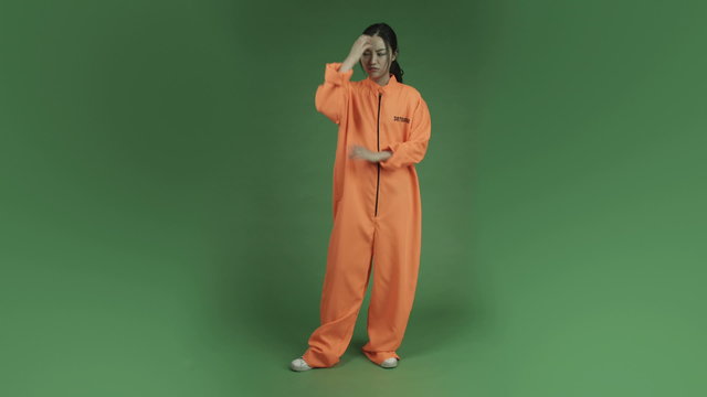 young asian adult woman prisoner isolated on green-screen
